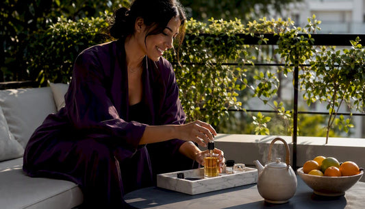Woman selecting natural perfume gift at home
