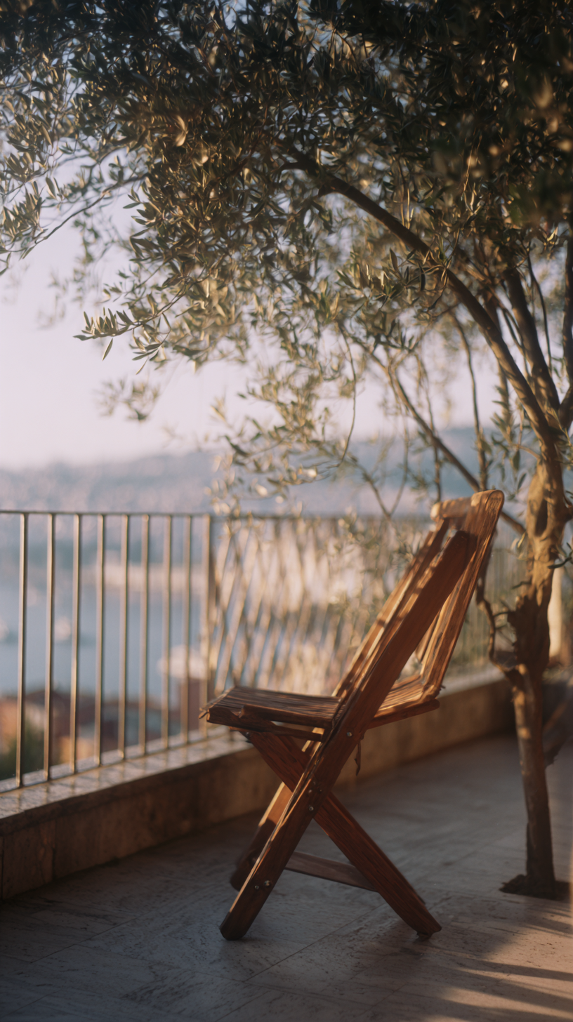 Slow luxury niche perfumery philosophy — Sofia Coppola empty terrace vintage wood · Maison Voyageur Mediterranean editorial Imagen